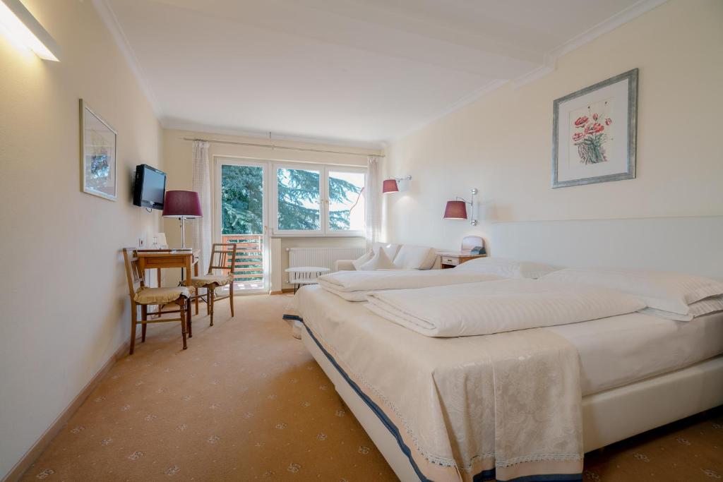 Postel nebo postele na pokoji v ubytování Hotel Aster