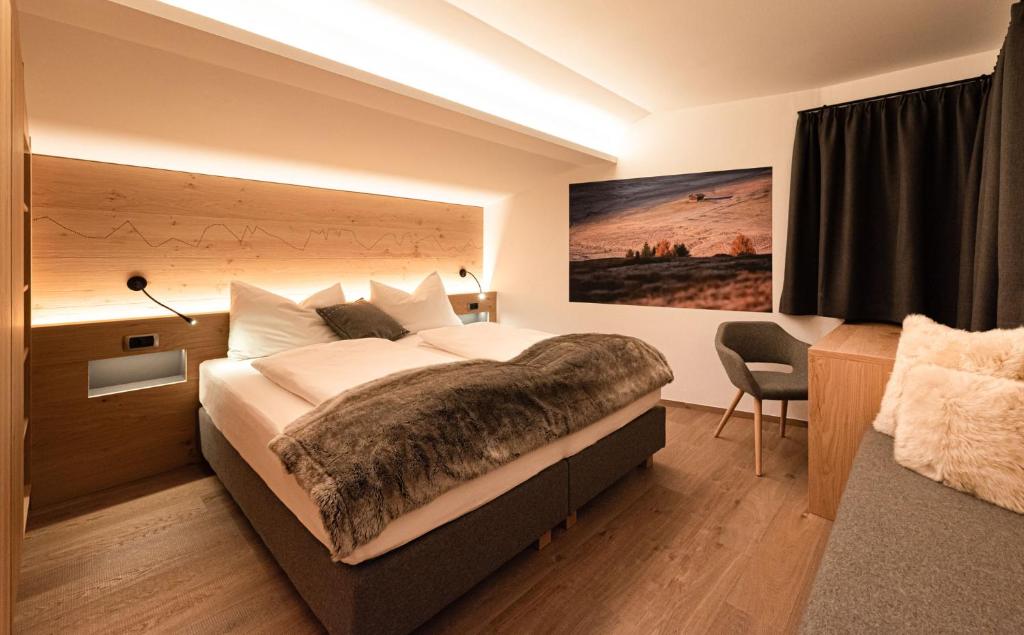 Łóżko lub łóżka w pokoju w obiekcie Residence Sovara