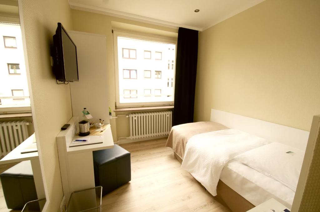 Postel nebo postele na pokoji v ubytování Hotel am Kieler Schloss by Première Classe
