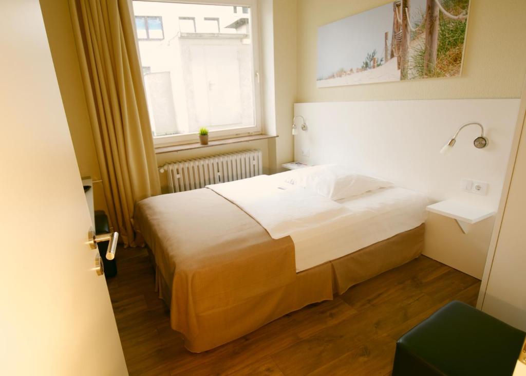 Postel nebo postele na pokoji v ubytování Hotel am Kieler Schloss by Première Classe