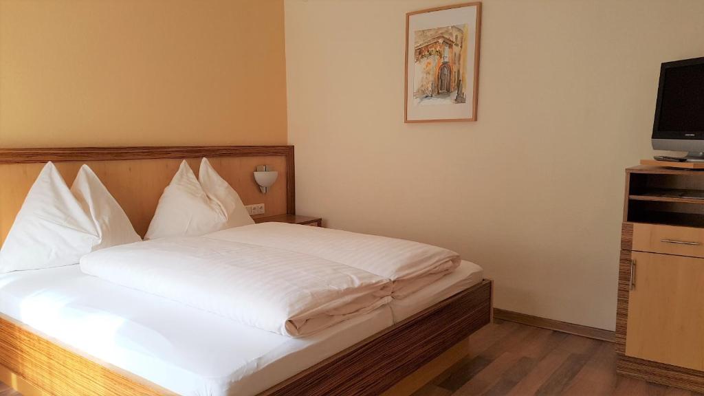 Postel nebo postele na pokoji v ubytování Hotel Sommerer - inklusive Joker Card im Sommer