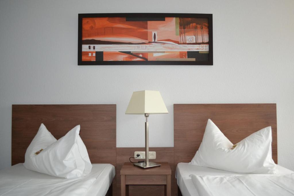 Postel nebo postele na pokoji v ubytování Best Western Hotel Erlangen