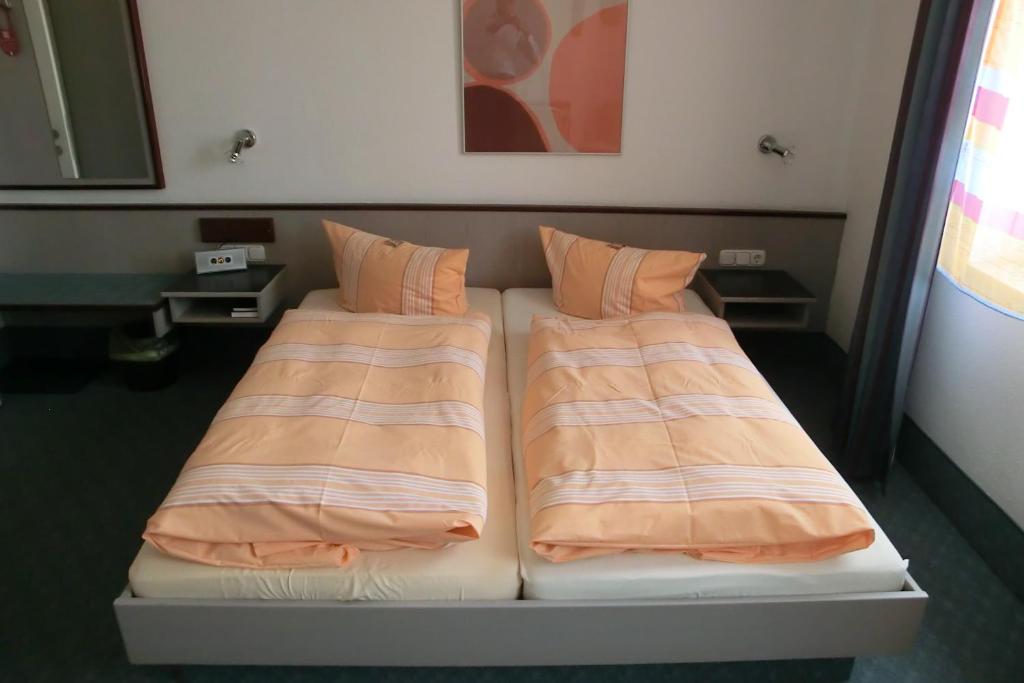 Postel nebo postele na pokoji v ubytování Hotel Eigen