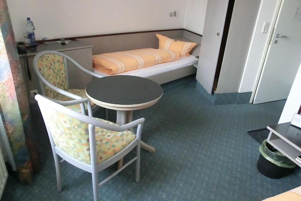 Postel nebo postele na pokoji v ubytování Hotel Eigen