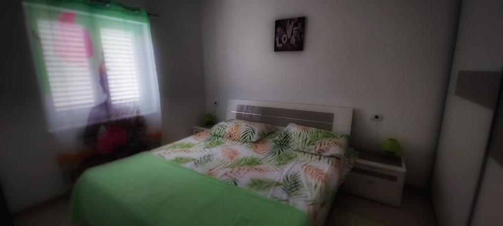 Postel nebo postele na pokoji v ubytování Apartmani Tomislav