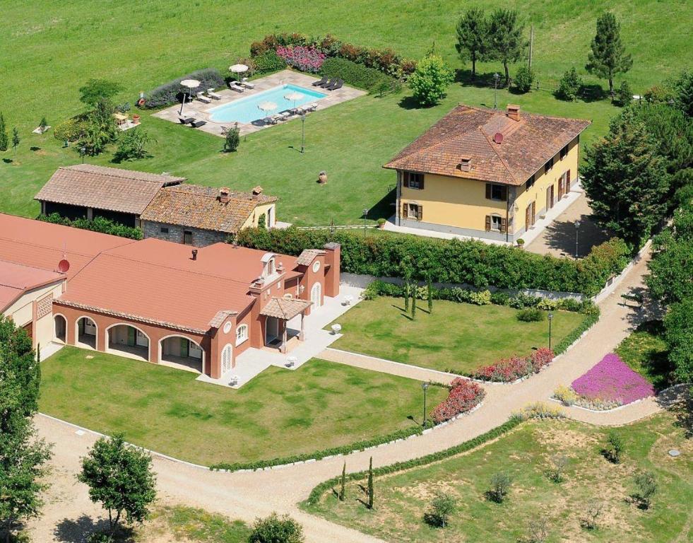 an aerial view of a house with a pool at Sant'Angelo Farmhouse in Bibbiena