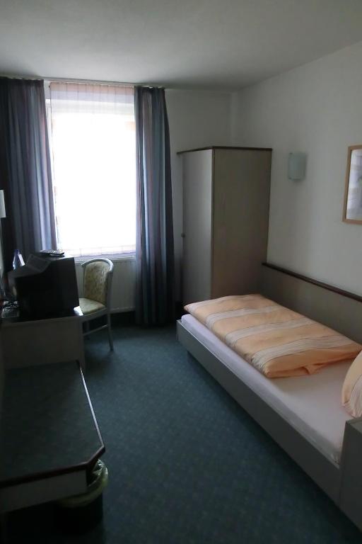 Postel nebo postele na pokoji v ubytování Hotel Eigen