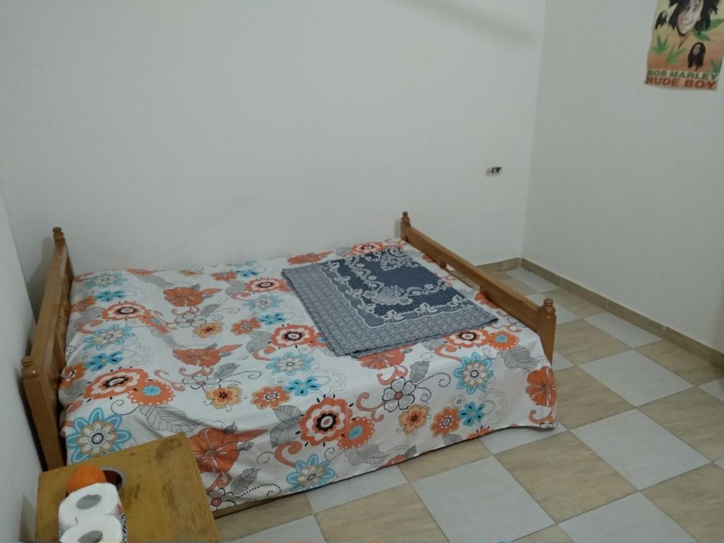 Postel nebo postele na pokoji v ubytování Bob Marley Homestay