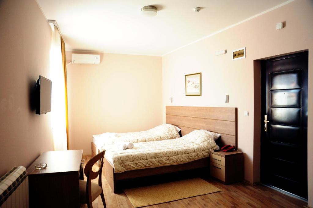 Postel nebo postele na pokoji v ubytování Garni Hotel Crystal Ice