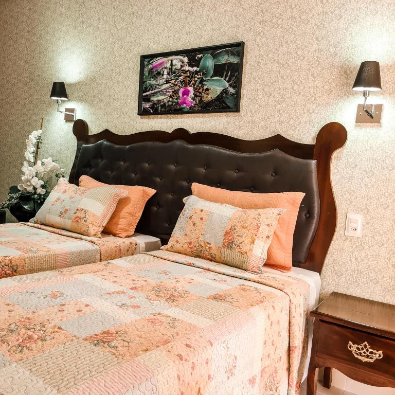 Cama ou camas em um quarto em Terra dos Diamantes Hotel