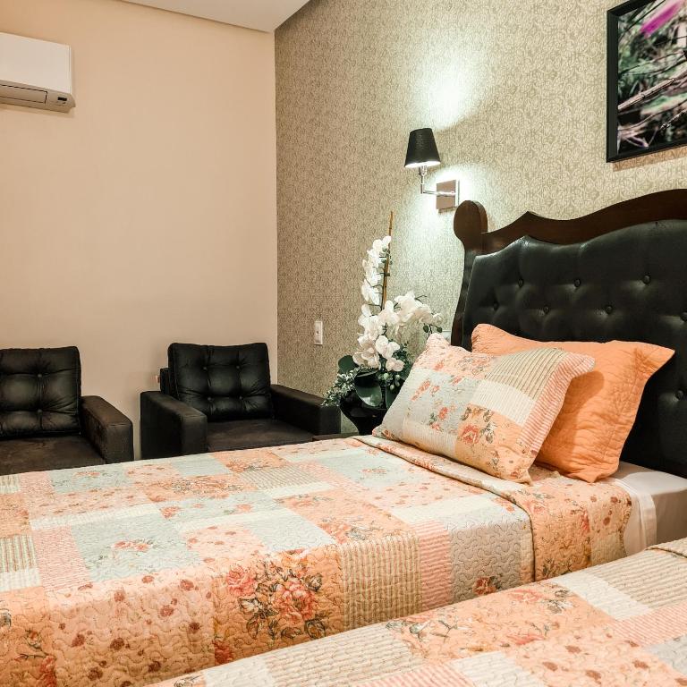 Cama ou camas em um quarto em Terra dos Diamantes Hotel