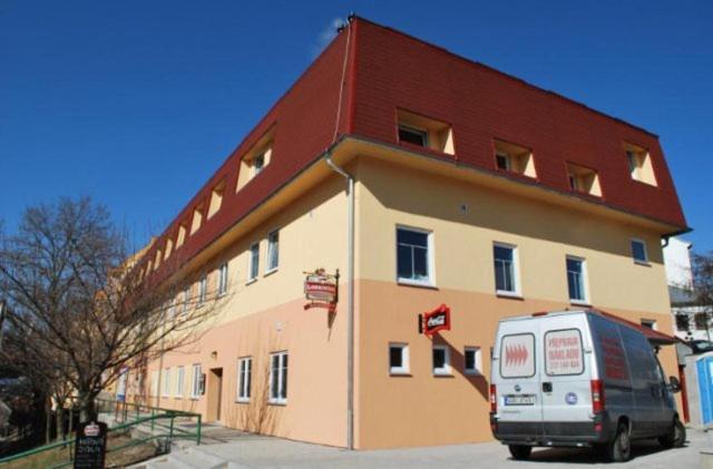 a van parked in front of a building at Penzion Mova in Kadaň