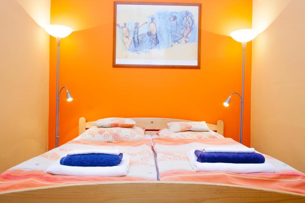 Posteľ alebo postele v izbe v ubytovaní City Centre Cosy Apartments