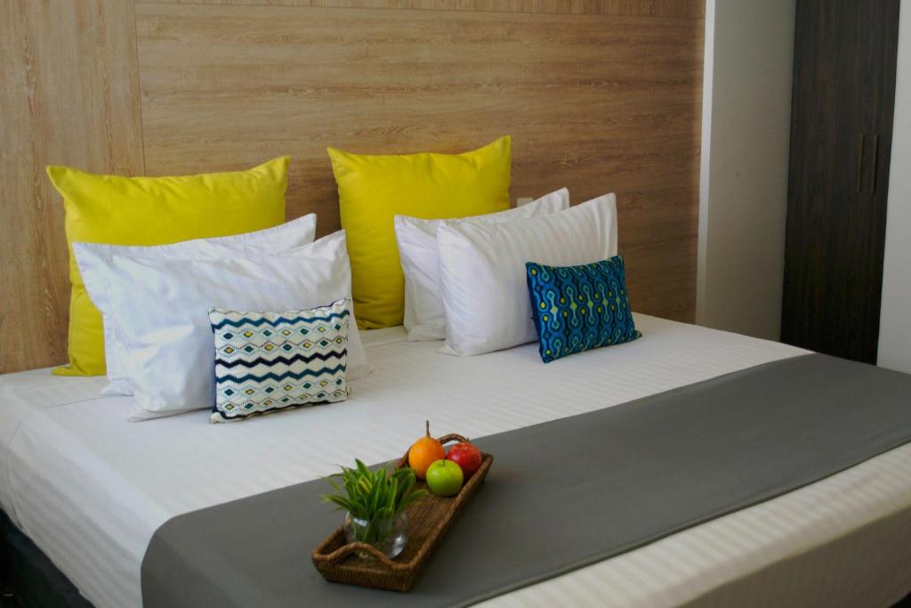 Postel nebo postele na pokoji v ubytování Hotel CasaBlanca Cucuta