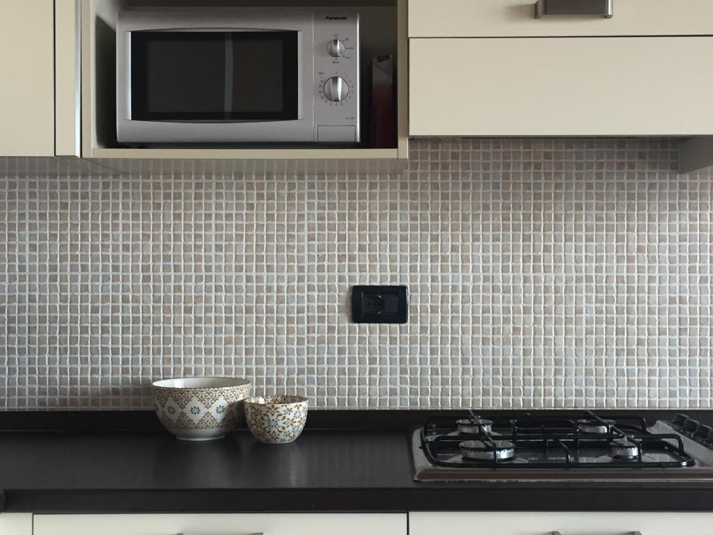 A kitchen or kitchenette at Appartamento Francesco - Theater Home