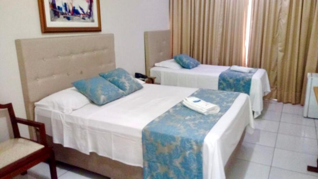 Postel nebo postele na pokoji v ubytování Max Hotel