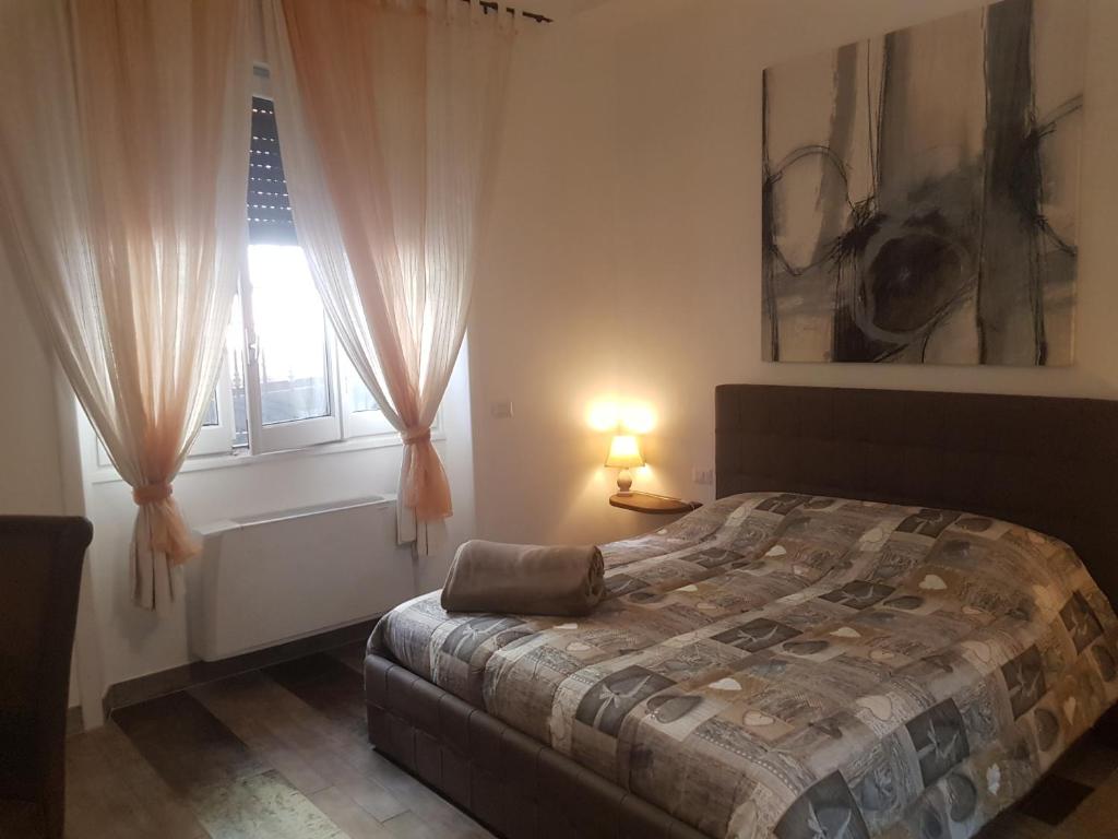 Postel nebo postele na pokoji v ubytování B&B Sansiromilano