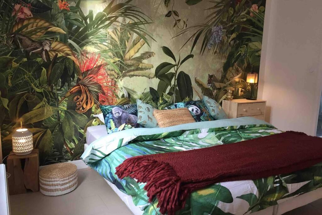 Voodi või voodid majutusasutuse Studio Jungle toas