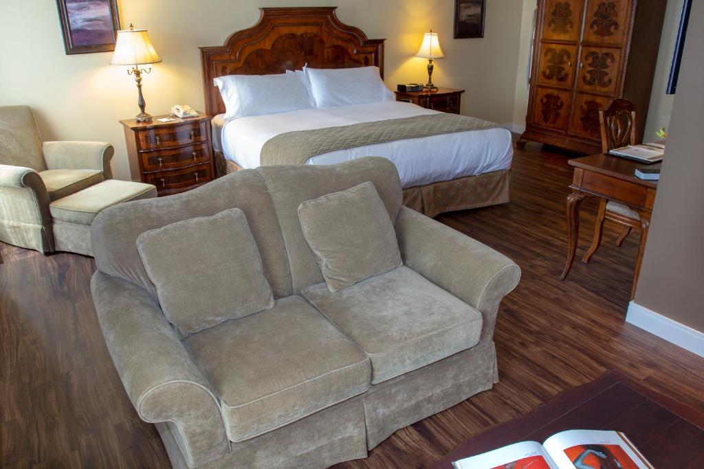 Postel nebo postele na pokoji v ubytování Hotel Brossard