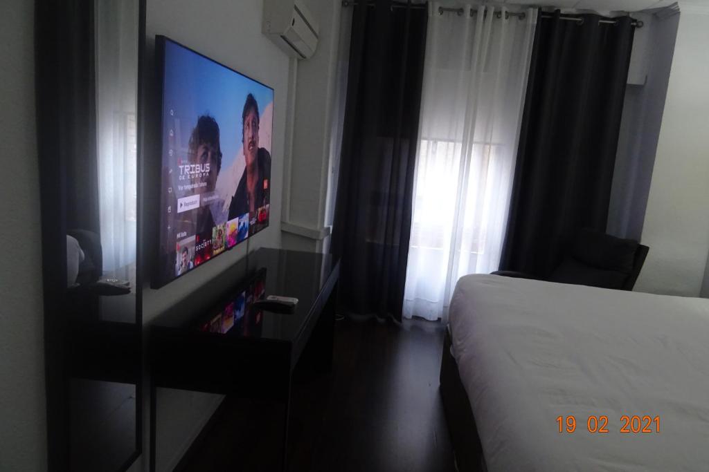 TV a/nebo společenská místnost v ubytování Hotel Carlos III