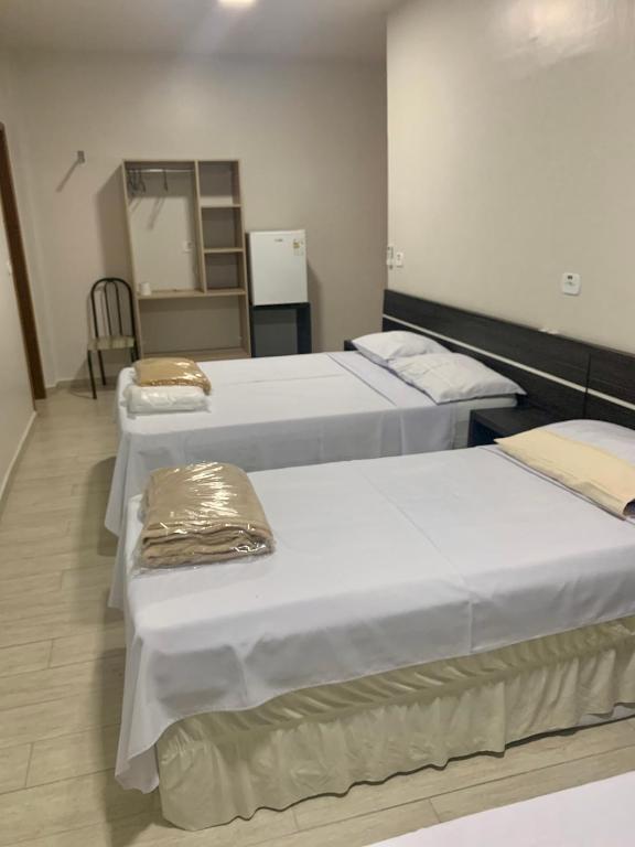 Postel nebo postele na pokoji v ubytování Hotel Paradizzo