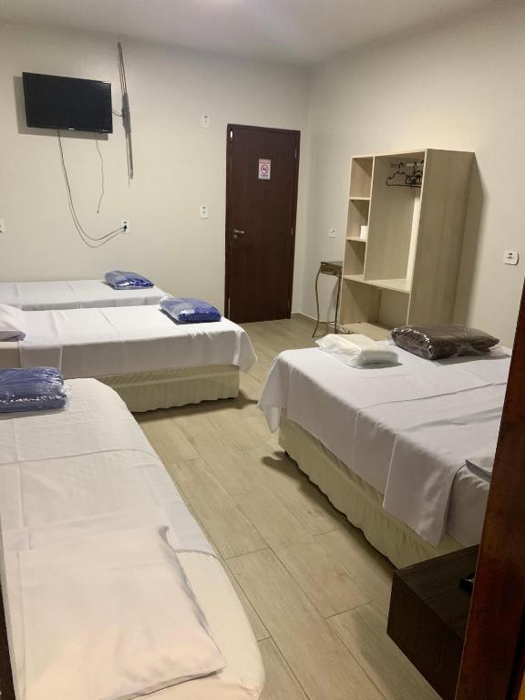 Postel nebo postele na pokoji v ubytování Hotel Paradizzo
