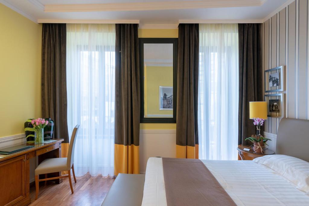 Postel nebo postele na pokoji v ubytování Palazzo Turchini