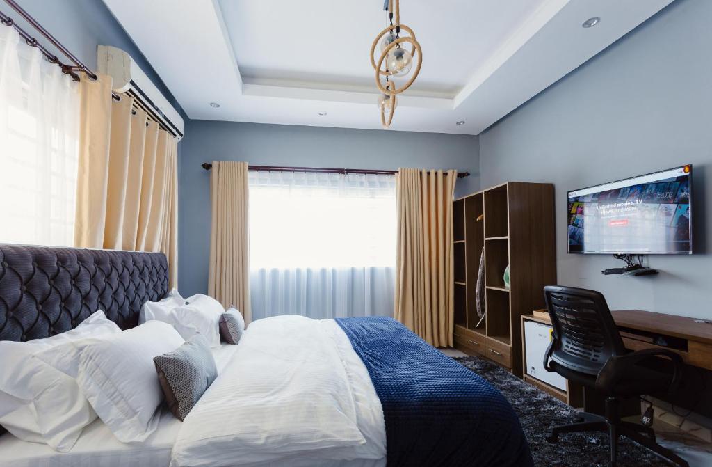 The Avery Suites, East Legon客房内的一张或多张床位