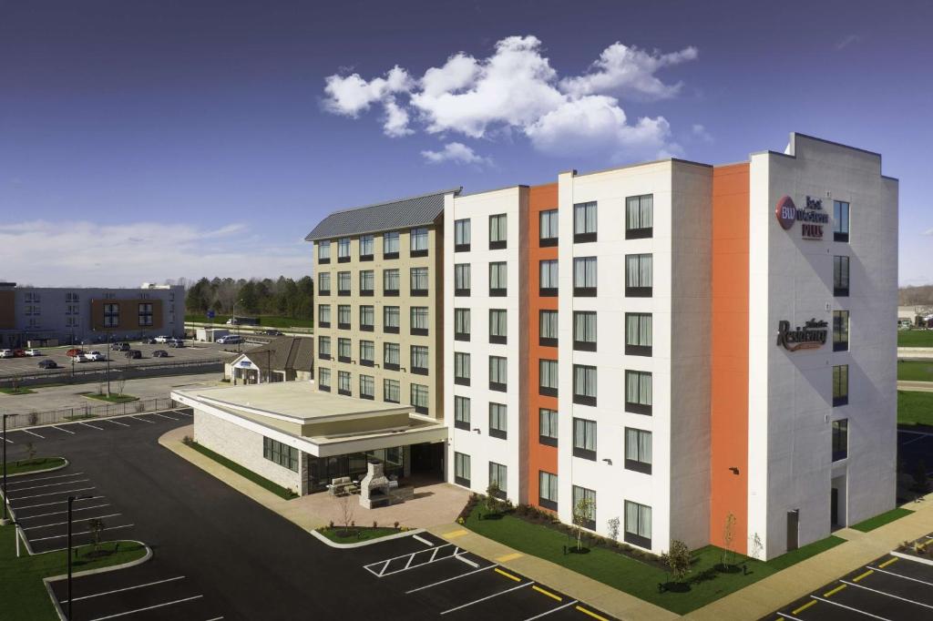 a rendering of a building with a parking lot at Best Western Plus Executive Residency Jackson Northeast in Jackson