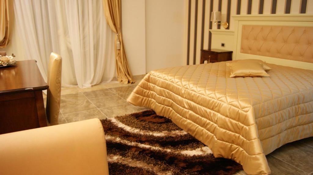 Postel nebo postele na pokoji v ubytování Regina di Saba - Hotel Villa per ricevimenti