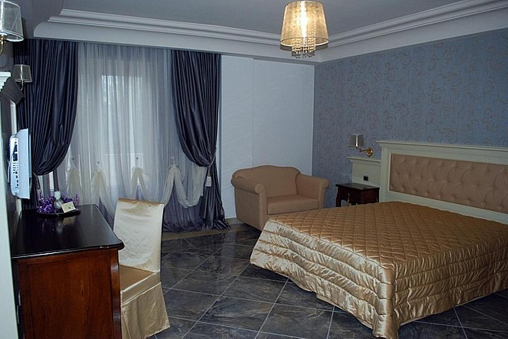 Postel nebo postele na pokoji v ubytování Regina di Saba - Hotel Villa per ricevimenti