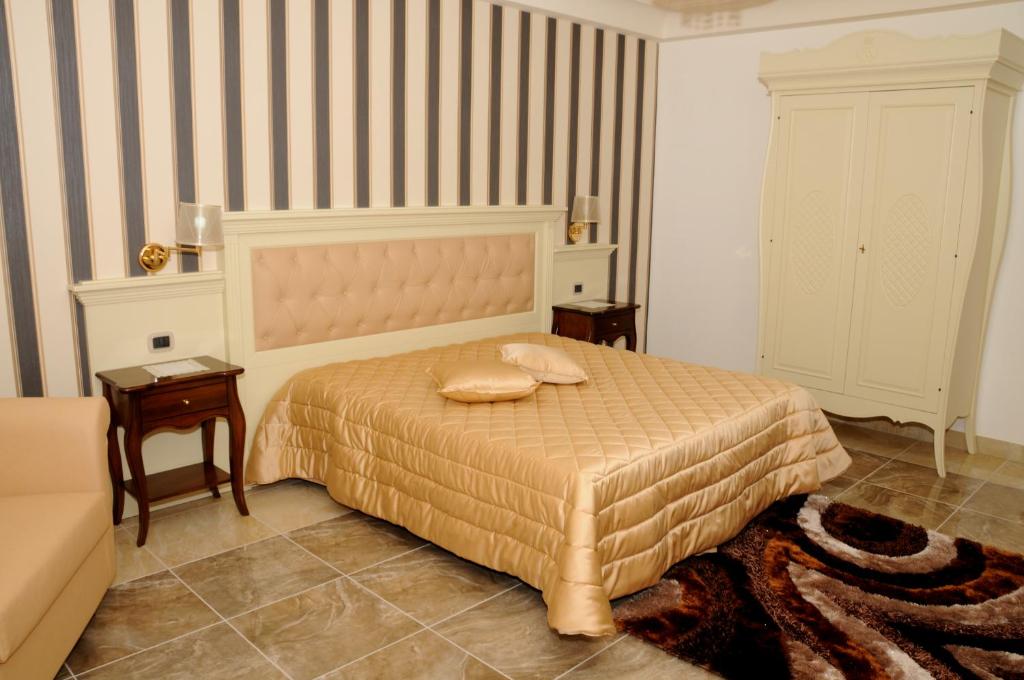 Postel nebo postele na pokoji v ubytování Regina di Saba - Hotel Villa per ricevimenti