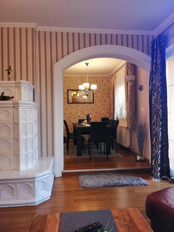 A kitchen or kitchenette at Elza Apartman