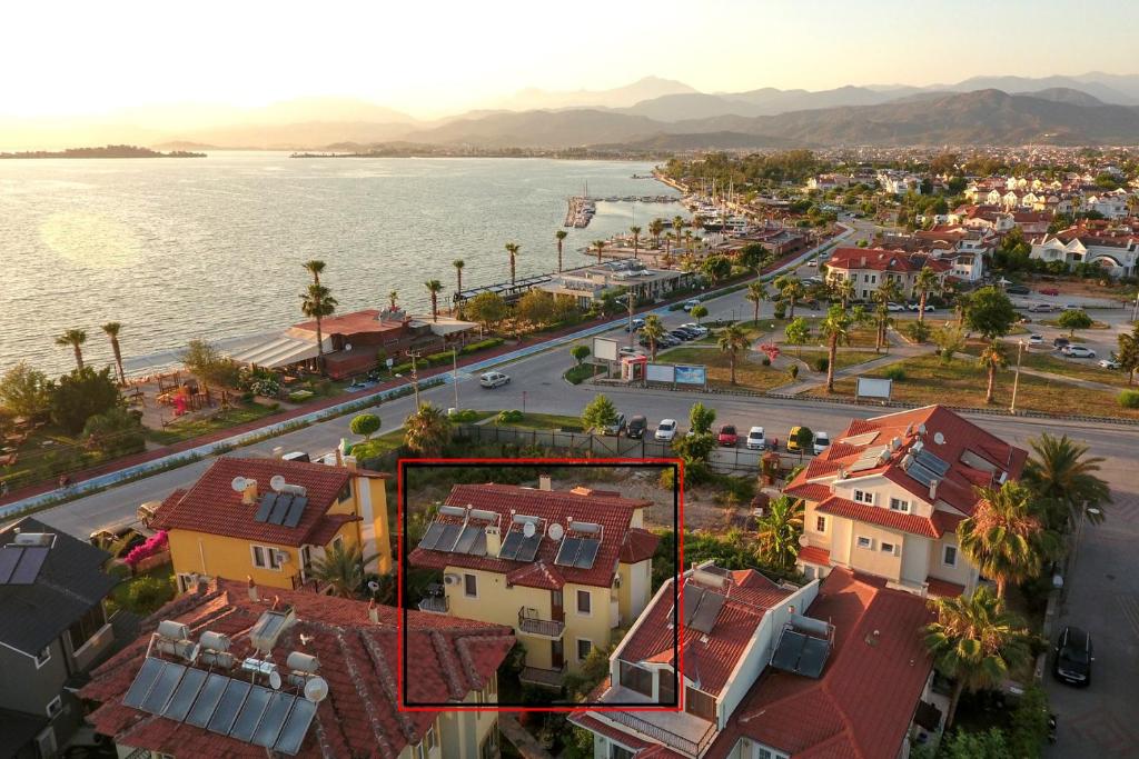 an aerial view of a city with houses and the water at Fethiye YALI SUITES in Fethiye