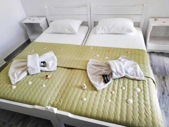 Postel nebo postele na pokoji v ubytování Cactus Beach Paros