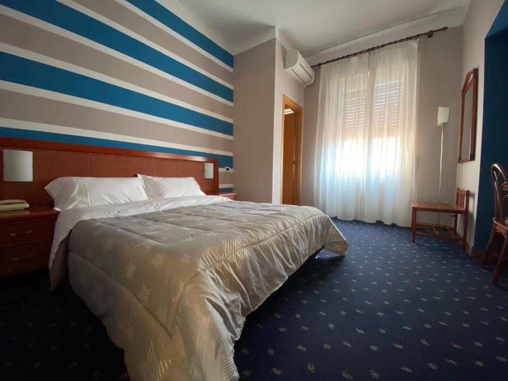 Postel nebo postele na pokoji v ubytování Hotel Kristina