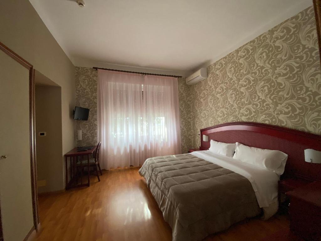 Postel nebo postele na pokoji v ubytování Hotel Kristina