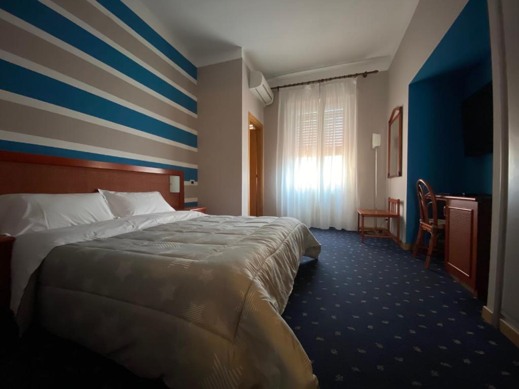Postel nebo postele na pokoji v ubytování Hotel Kristina