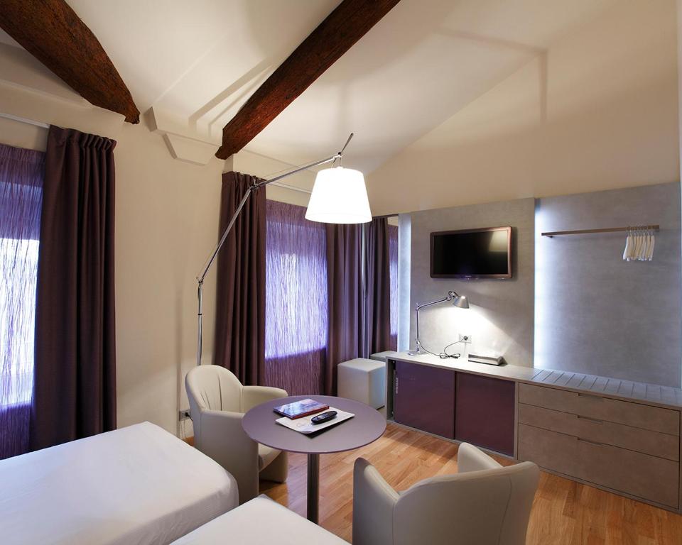 Postel nebo postele na pokoji v ubytování Hotel Annunziata
