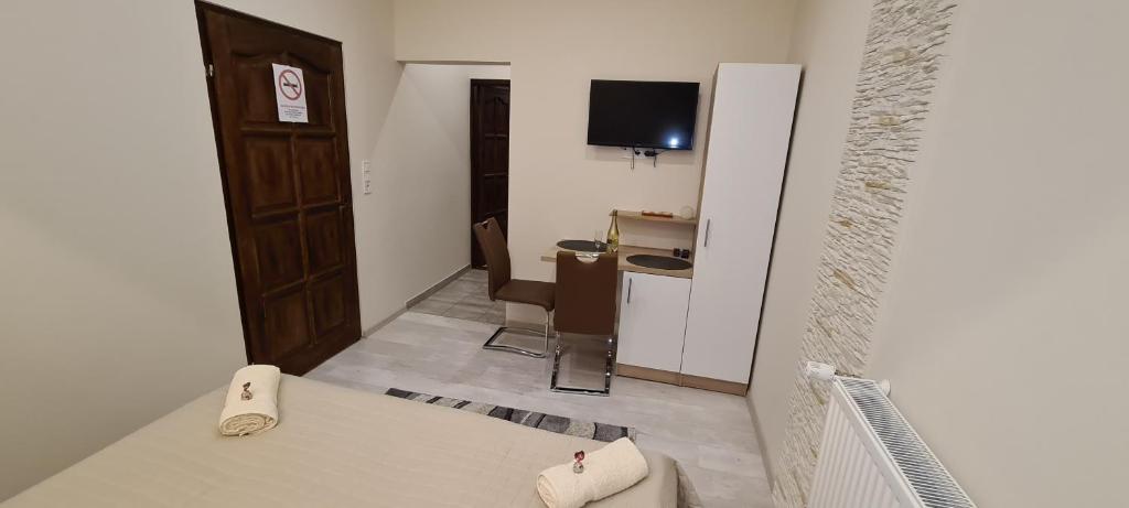 TV a/nebo společenská místnost v ubytování Rózsa Apartmanház