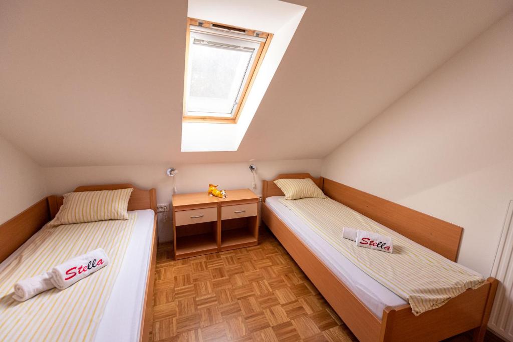 Postel nebo postele na pokoji v ubytování Apartment Stella