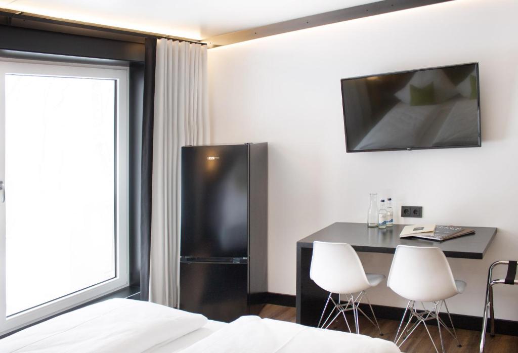 TV a/nebo společenská místnost v ubytování AU Hotel by WMM Hotels
