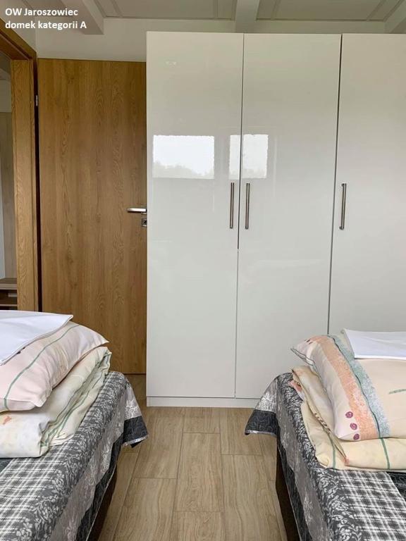 Postel nebo postele na pokoji v ubytování OW Jaroszowiec