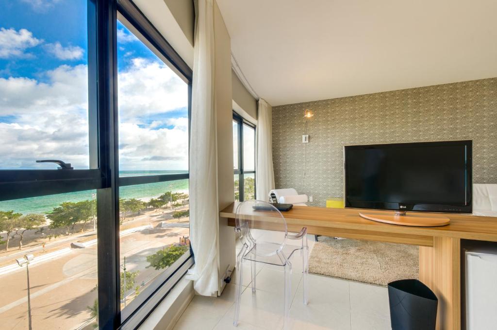 TV a/nebo společenská místnost v ubytování Meridiano Hotel