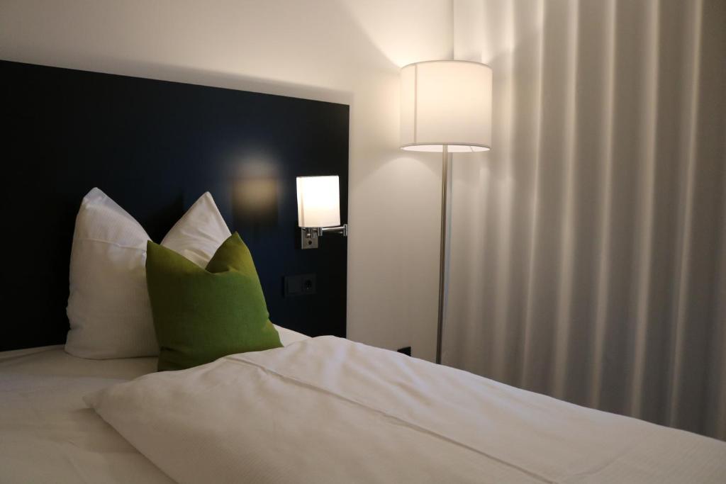 Postel nebo postele na pokoji v ubytování AU Hotel by WMM Hotels