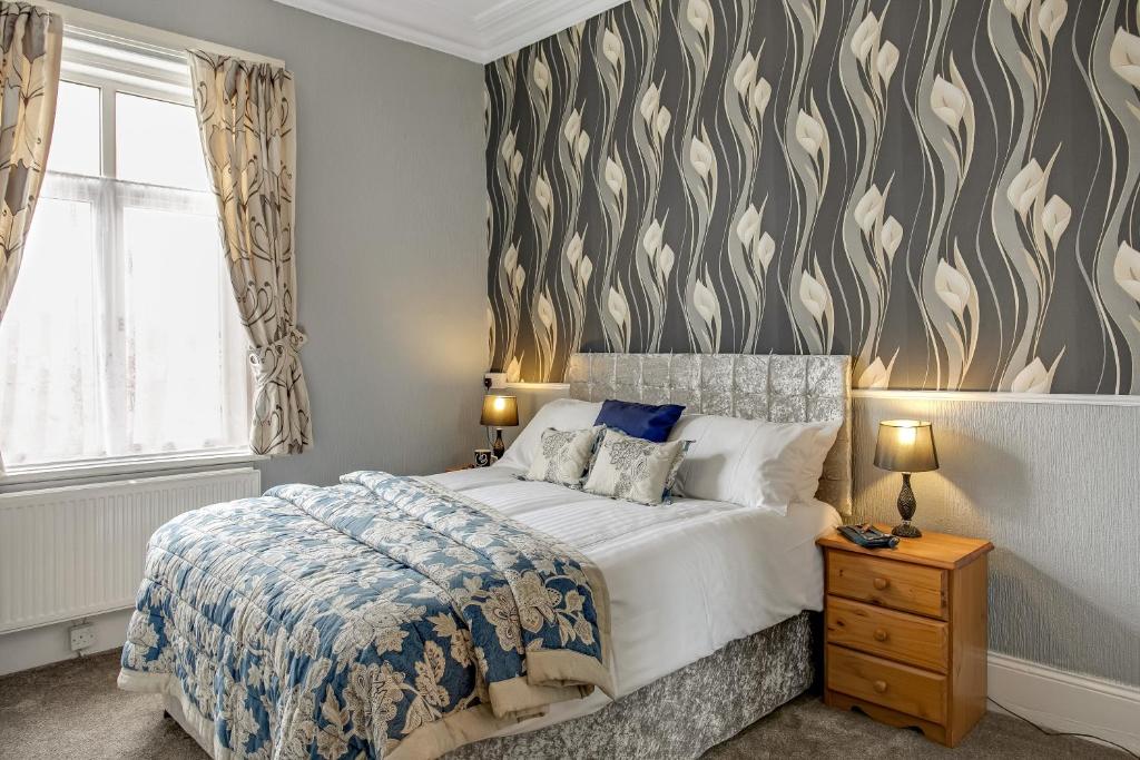 Postel nebo postele na pokoji v ubytování The Chesterfield Guest House, Torquay