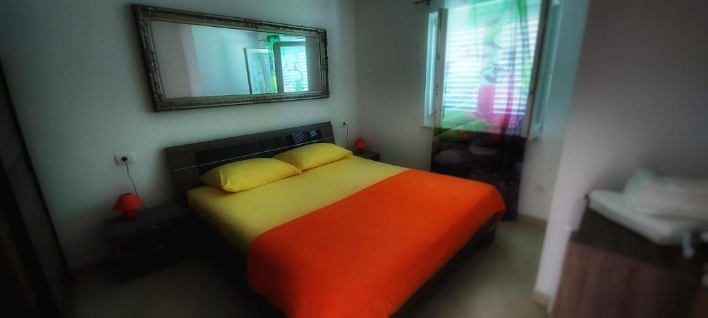 Postel nebo postele na pokoji v ubytování Apartmani Tomislav