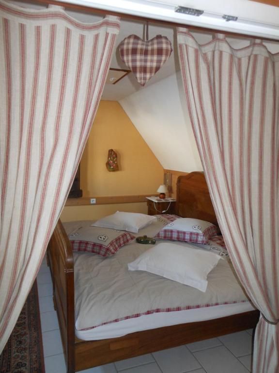 Postel nebo postele na pokoji v ubytování Gite Le Petit Moulin