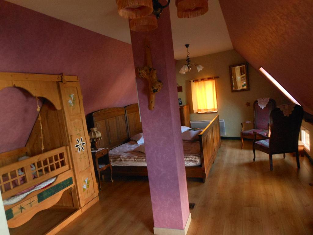Postel nebo postele na pokoji v ubytování Gite Le Petit Moulin