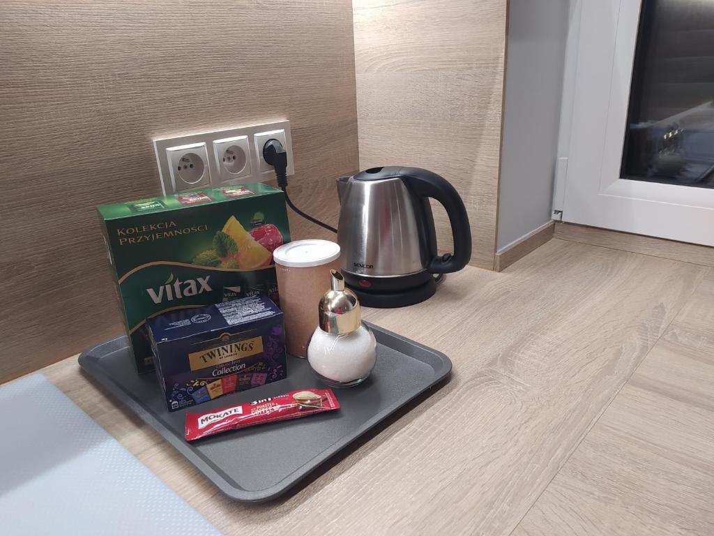 Príslušenstvo na prípravu kávy alebo čaju v ubytovaní Apartament z widokiem